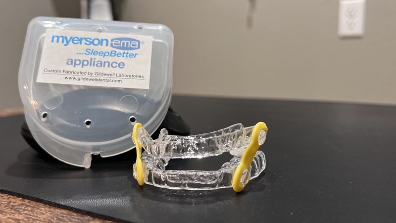 A custom oral appliance used to treat snoring and sleep apnea