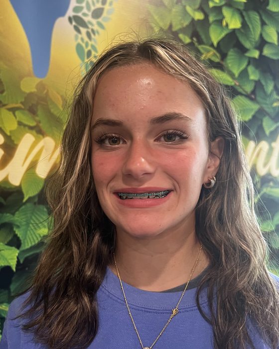 A smiling teenage patient wearing braces at Valley Family Dental